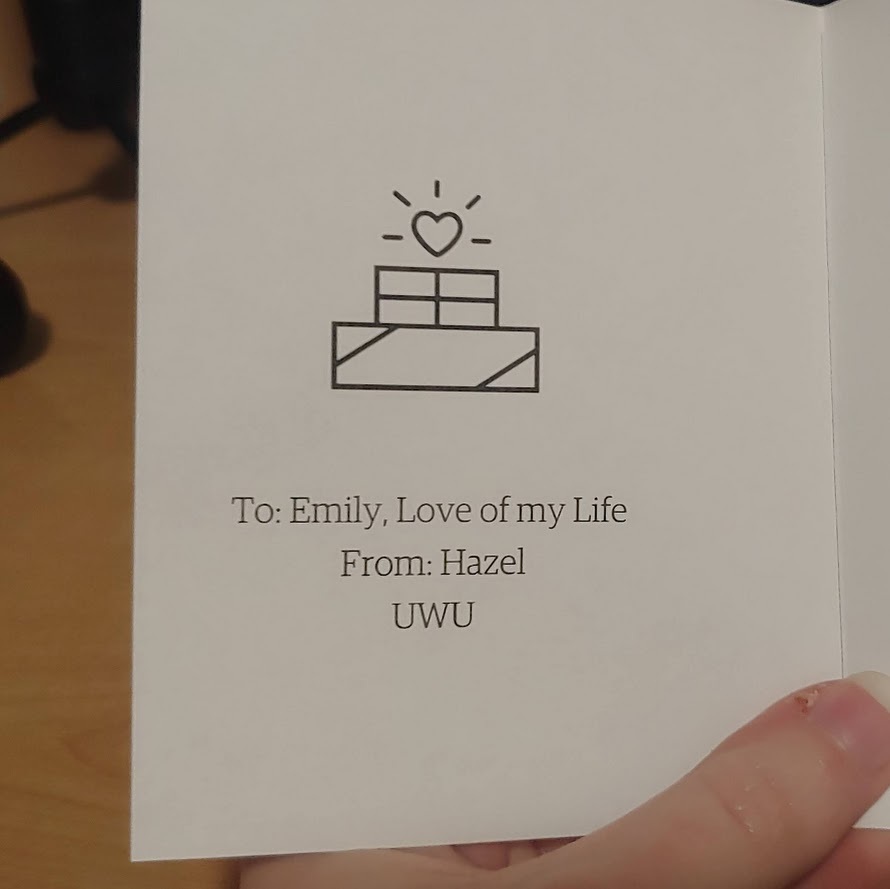 A note that reads: "To: Emily, love of my life. From: Hazel UWU"